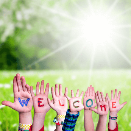 hands spelling out the word welcome